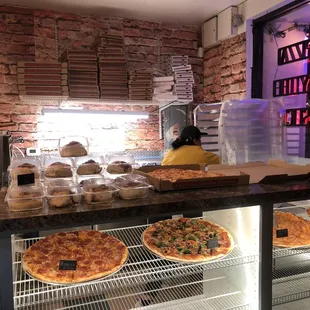 pizzas on display