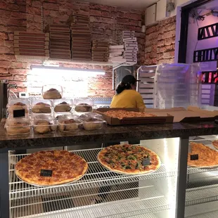 pizzas on display