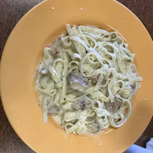 a yellow plate of pasta