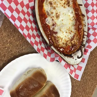 two hot dogs on a paper plate