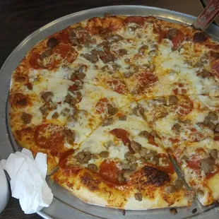 Medium pizza, easy on the sauce, with pepperoni and ground beef.