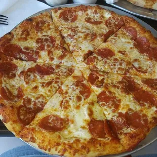 Medium pizza w/ pepperoni, easy on the sauce, and extra cheese.