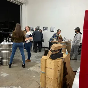 a group of people in a wine cellar