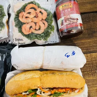 a bag of vegan shrimp and a sandwich