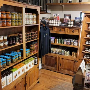 the store's display of various wines and condiments