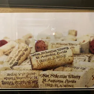 corks of wine in a glass case