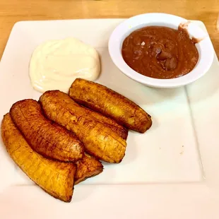 Platano Frito- prepared perfecto! Refried Beans and Crème.