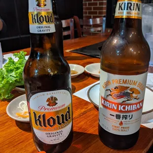 two beer bottles on a table