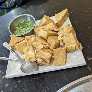 Fried tofu with garlic, chive, and vinegar dipping sauce