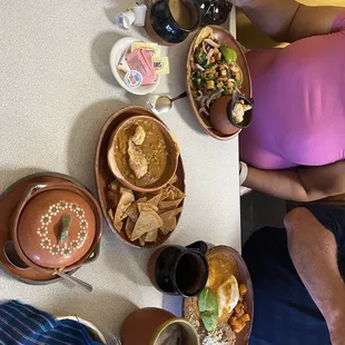 Al pastor tacos, chilequiles, and beans