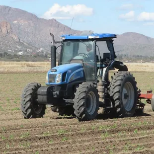 a tractor plowing a field