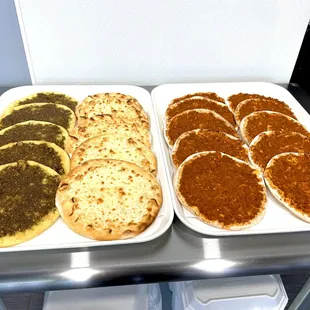 two trays of food on a table