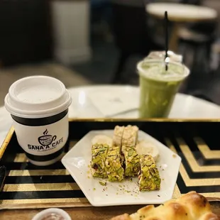 a plate of food and a cup of coffee