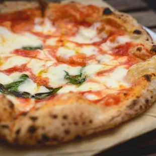 Hand-tossed Neapolitan pizza we make in our cafe