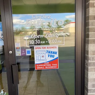 a sign on the door of a restaurant