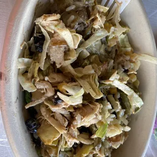 a bowl of food with a fork in it