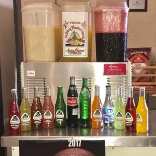 a variety of sodas and condiments