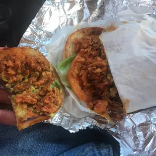 a person&apos;s hand holding a taco sandwich