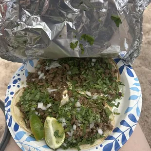 a person holding a plate of food