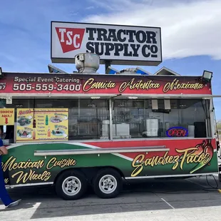 a man standing in front of a food truck