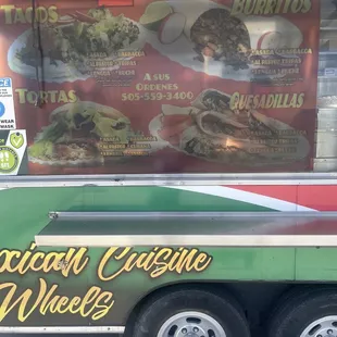 a mexican cuisine truck parked on the side of the road