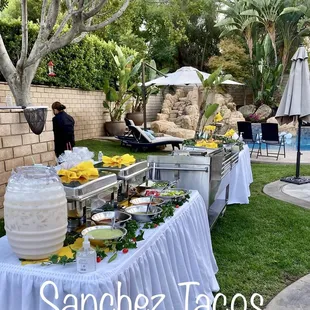 a buffet table with a variety of food items