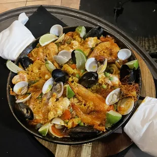 a pan of seafood and rice