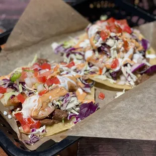 two tacoss with toppings