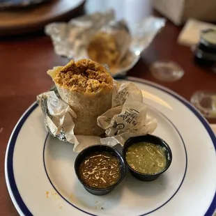 Fantastic Sawed Off Chorizo Breakfast Burrito and two delicious salsa. Hector's Spicy and Verde.