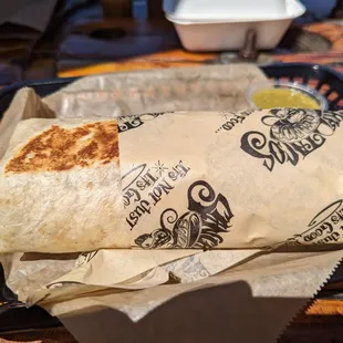 Burrito with beans rice and cheese.