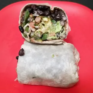 Super veggie burrito. No rice because it is cooked in chicken broth, and no cheese or sour cream to make it vegan