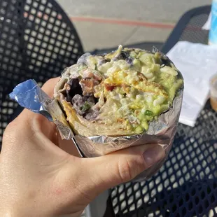 Breakfast Burrito, chorizo or bacon, cheese, eggs, salsa, choice of beans, guacamole and sour cream. Yum!