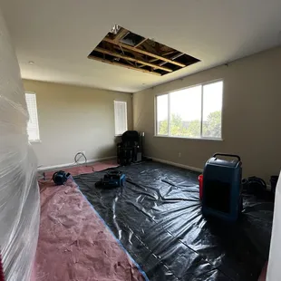 Damaged sheetrock removed. Moisture mitigation started.