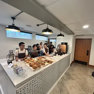 a group of people standing at the counter