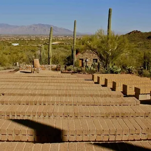 Outdoor seating with a beautiful view of the chapel, hills and surroundings at the Sanctuary Cove.