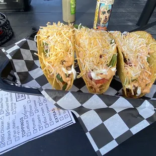 1 pork, chicken, and ground beef taco on hard shells