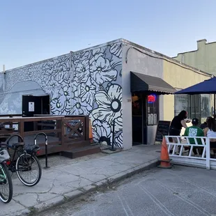 a bicycle parked in front of a restaurant