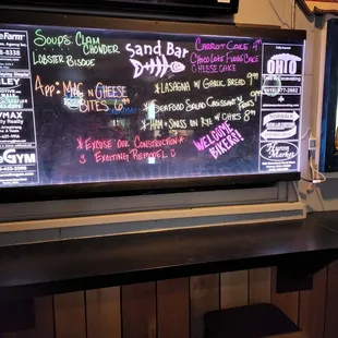 a chalkboard with various drinks on it