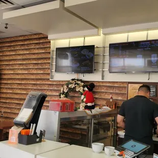 a man working in a coffee shop