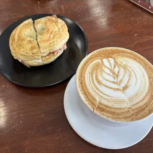 Arroz con leche latte and bagel with cream cheese, prosciutto and tomato.
