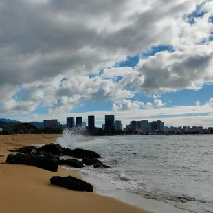 The waves crashed against the rocks!