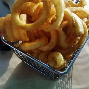 Hot and Crunchy side of Curly Fries in a cute metal basket. Stole some of my husbands and put it into my basket!