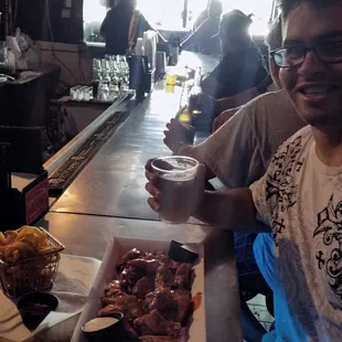 Zach, with his beer and wings!