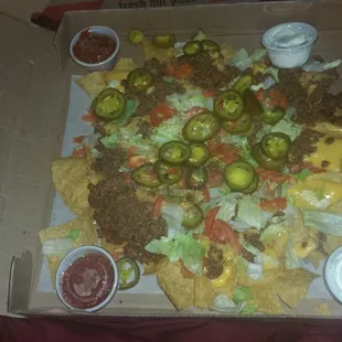 Nacho supreme to go.  It was Alot.  Came in a pizza box.