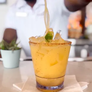 a bartender pouring a drink