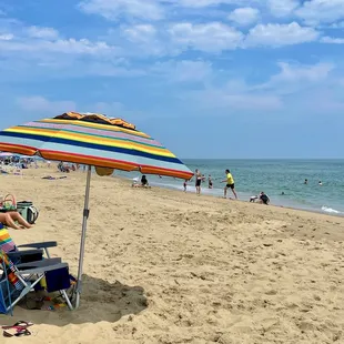 I love seeing the colorful umbrella on the beach