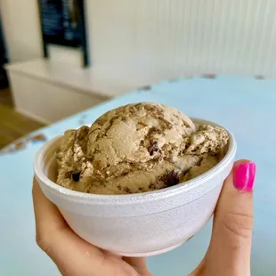 Caramel chocolate brownie ice cream in a cup