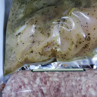 Marinated chicken breasts and pork sausage