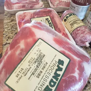 a variety of meats on a counter