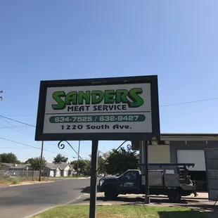 a sign in front of a building